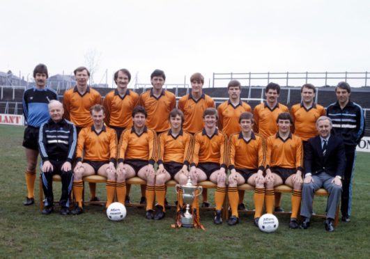 Dundee United title winners. Back row from left: Hamish McAlpine, Davie Dodds, Ian Phillip, David Narey, Richard Gough, Derek Stark, John Holt, Eamonn Bannon and Walter Smith (coach). Front row: Andy Dickson (physio), John Reilly, Ralph Milne, Paul Sturrock, Paul Hegarty (captain), Billy Kirkwood, Maurice Malpas and Jim McLean (manager).