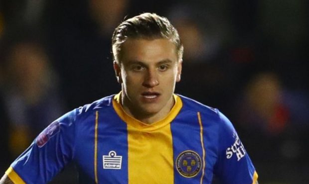 Jason Cummings in action for Shrewsbury against Liverpool.