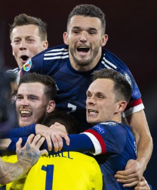 Shankland and his Scotland team-mates celebrate penalty shoot-out win over Israel.