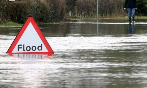 A sign in a flooded road.