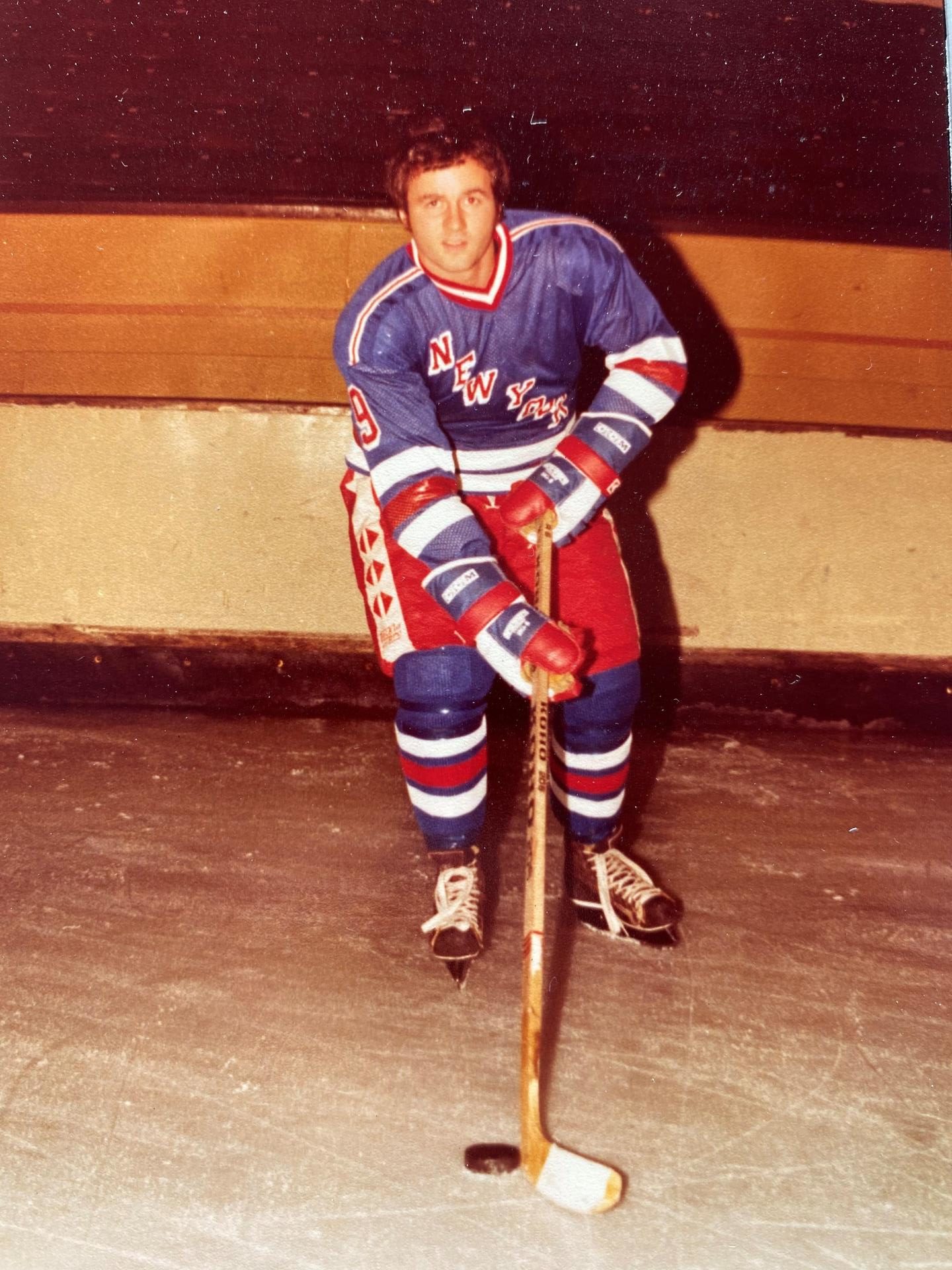 Roy on the ice with his hockey stick