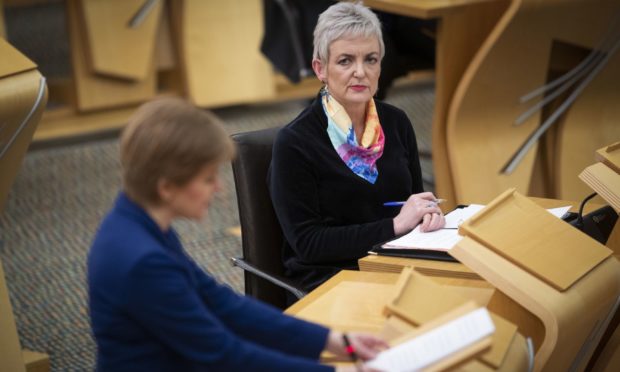 Nicola Sturgeon in the Scottish Parliament alongside Angela Constance discussing the Scotland drug laws