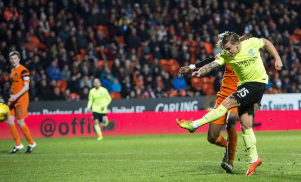 Jason Cummings scores against Dundee United.