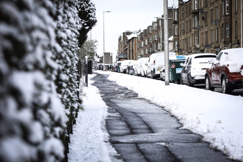 A path cleared on Clepington Road as snow hit on Monday, February 1.