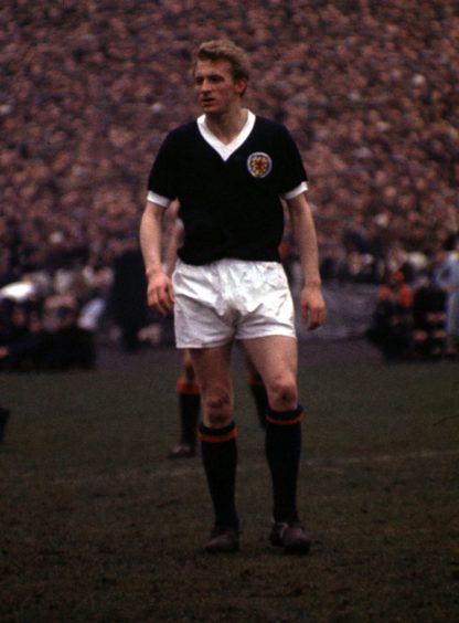 Denis Law playing for Scotland.
