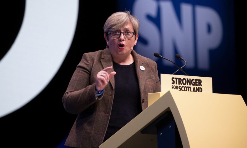 Joanna Cherry speaking at an SNP podium