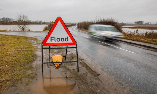 The A923 off Butterybank Road after the River Isla overflowed.