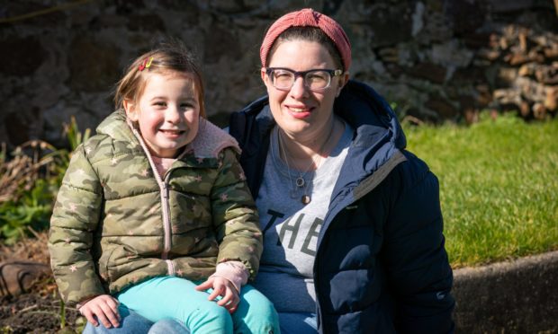 Chloe Milne with daughter Robin. who she deferred from starting school this year.