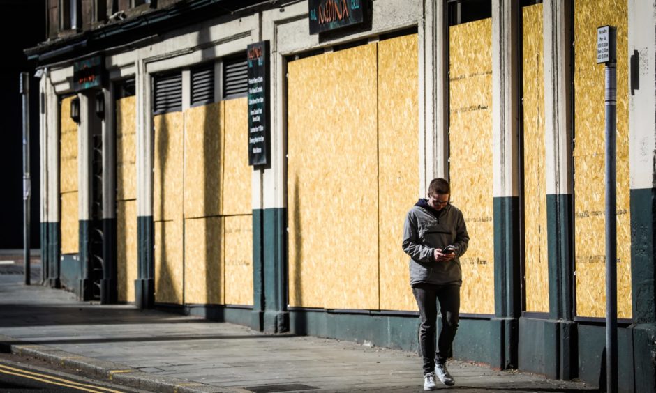 A boarded-up pub in Dundee city centre.