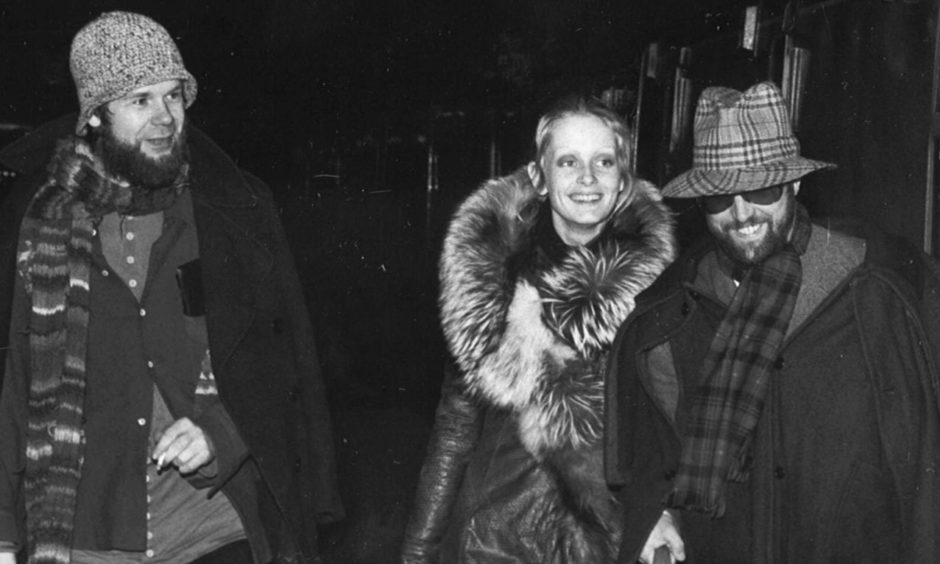 Bill Gibb, Twiggy and Justin De Villeneuve arriving at Aberdeen Station in the 1970s.