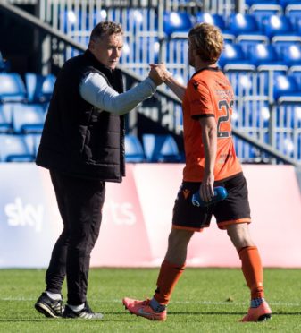 Dundee United boss Micky Mellon embraces Kieran Freeman.