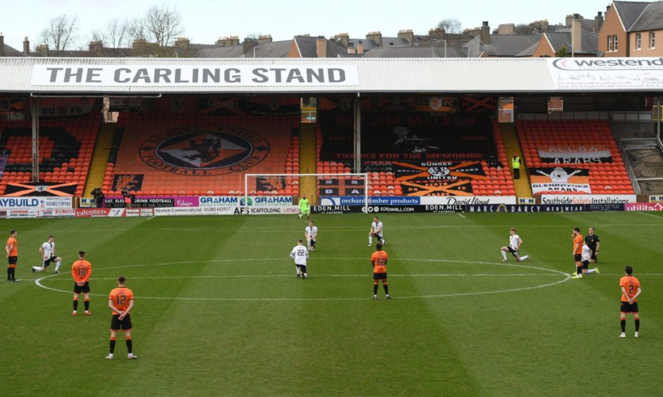 DUNDEE, SCOTLAND - MARCH 20: Dundee United Players make a stand against racism instead of taking a knee during the Scottish Premiership match between Dundee United and Aberdeen at Tannadice on March 20, 2021, in Dundee, Scotland. (Photo by Craig Foy / SNS Group)