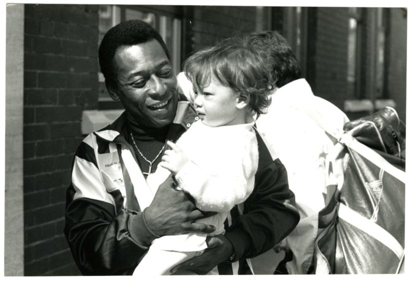 Pelé with Kristopher Johnston during his visit to Dundee in 1989. Picture: DC Thomson.