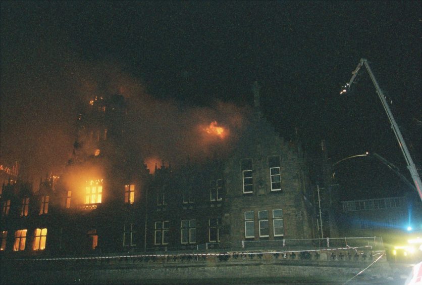 The front of Morgan Academy as the fire spreads.