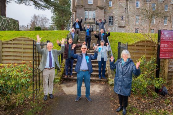 Tory Frank Smith Scottish celebrates alongside party members.