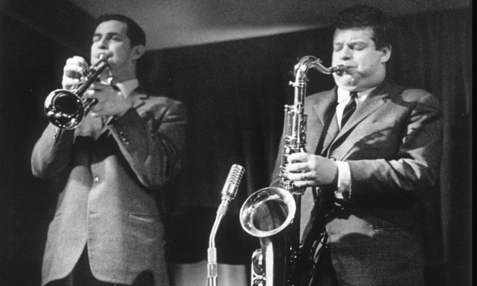 Jimmy Deuchar performing on stage with Tubby Hayes.