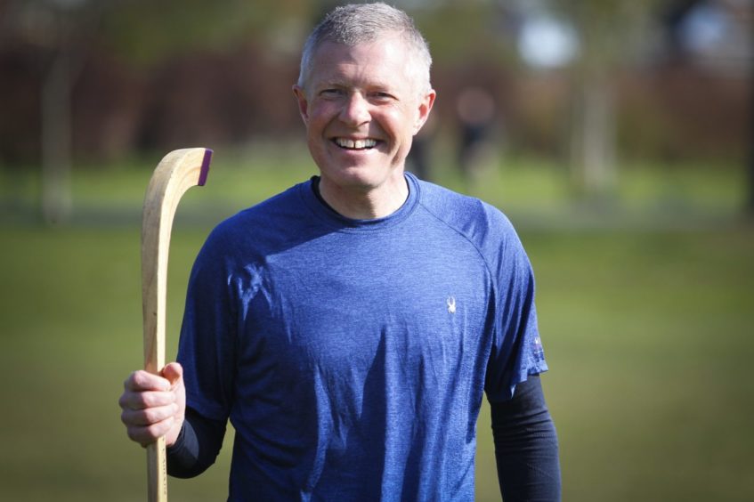 Willie Rennie playing shinty in Edinburgh during the most recent election campaign.
