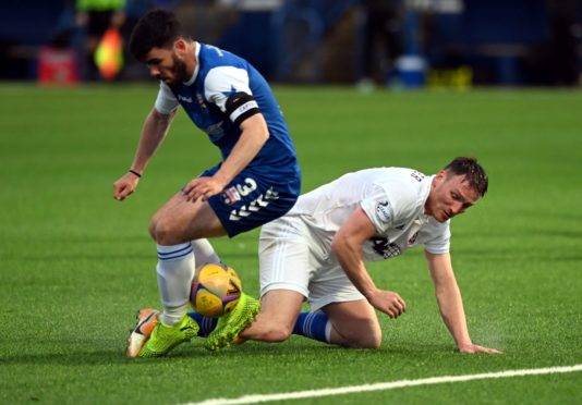 Cove Rangers' Rory McAllister is tackled by Montrose captain Andrew Steeves.