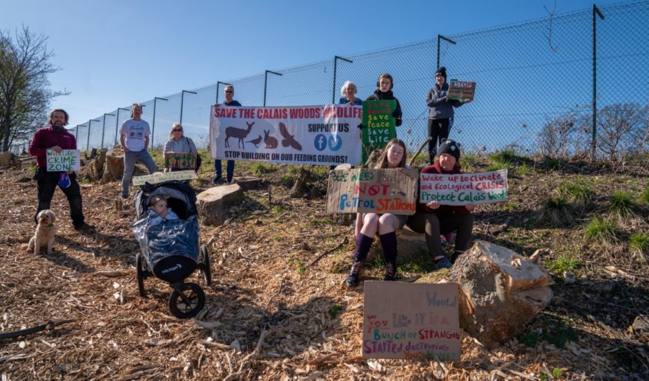 Protesters at the site of the proposed development.