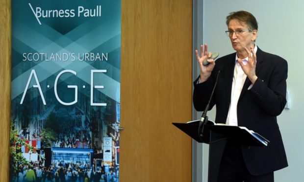 Prof Brian Evans speaking at the unveiling of the 100-page Urban Age report in 2018.