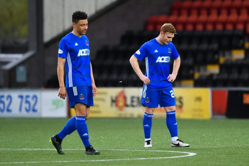 Cove's Fraser Fyvie (R) and Leighton McIntosh at full-time against Airdrieonians.