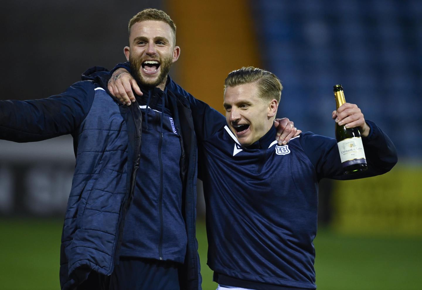 Dundee's Jason Cummings (R) and Christie Elliott at full time.