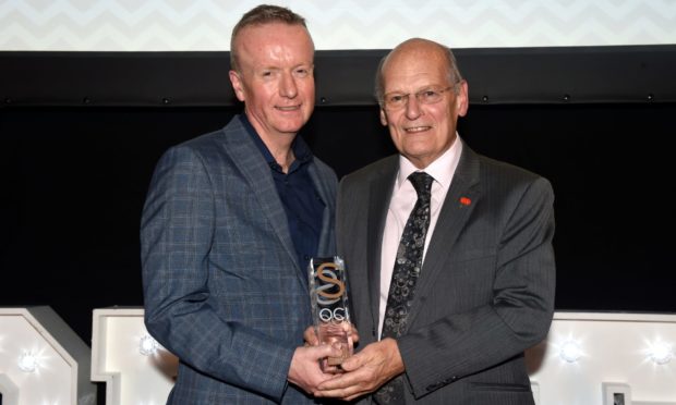 CR0009262 Society awards 2019 at Sandman Signature Hotel, St Andrew Street, Aberdeen. Outstanding Contribution of the Year - John Michie. Picture of Presenter Adrian Watson and John Michie. Picture by KENNY ELRICK 06/11/2019