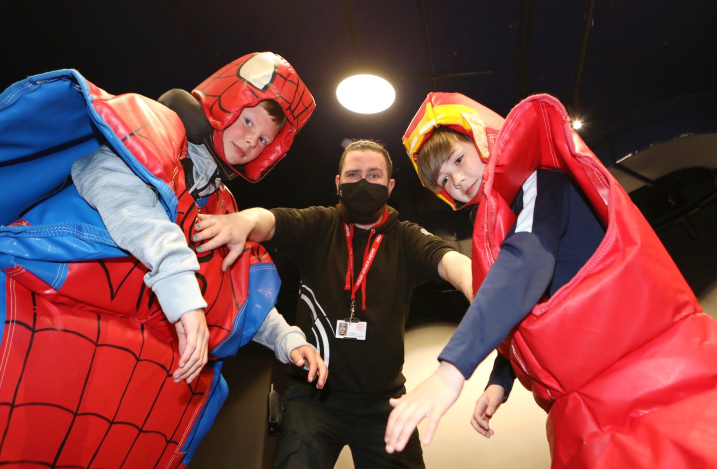 Aeden Malone and Michael Duff battle as sumo wrestlers with Lewis Fitzsimmons the referee.