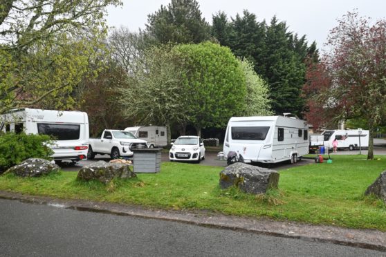 Travellers set up in the car park