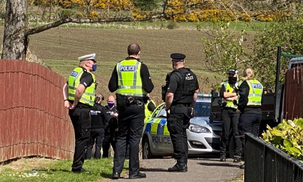 Police officers at the scene on Wednesday in Fife.