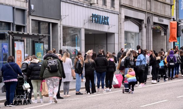 Shoppers queue in Union Street on Monday