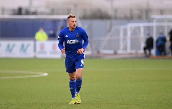 Connor Scully in action for Cove against Partick Thistle.