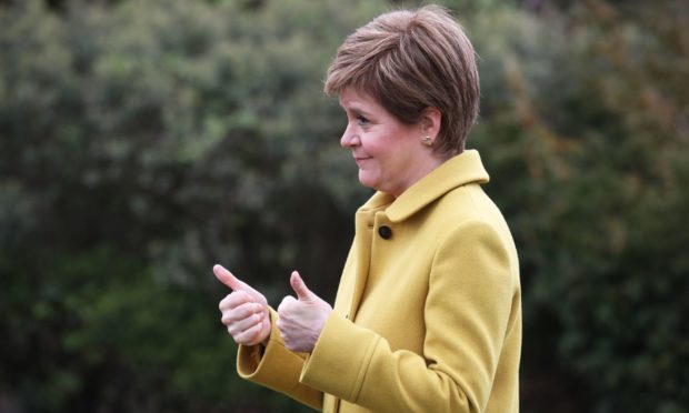 Nicola Sturgeon giving a thumbs up