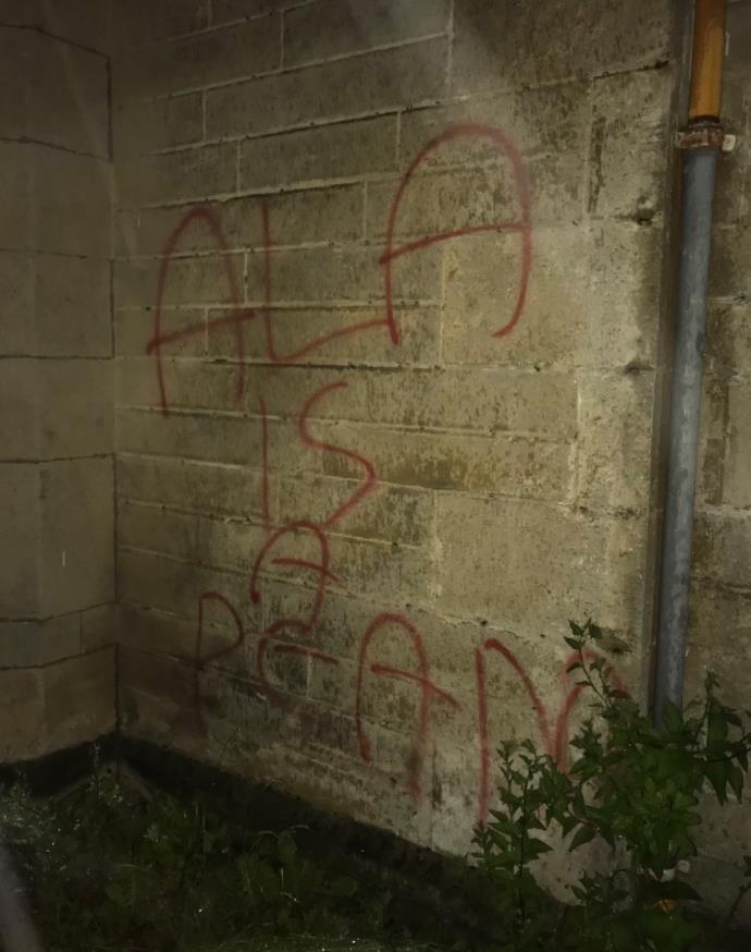 Graffiti on the wall says Ala Is A Peado
