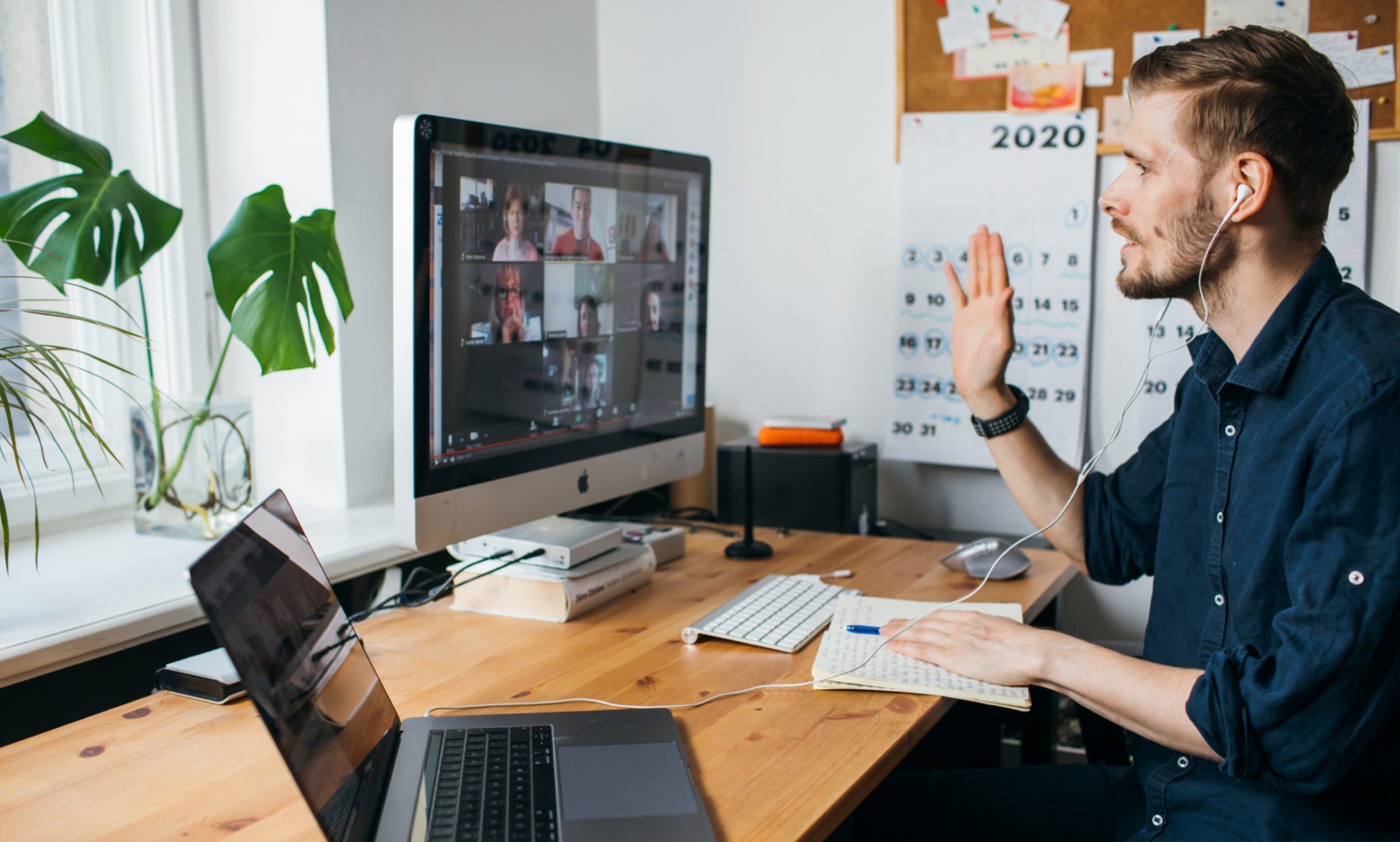 A man takes part in a Zoom video conference.