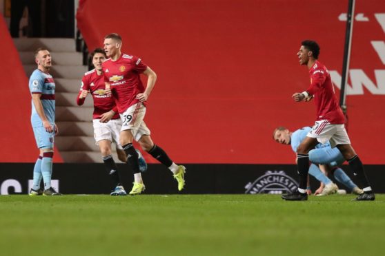 Scott McTominay and Marcus Rashford in action at club level for Manchester United.