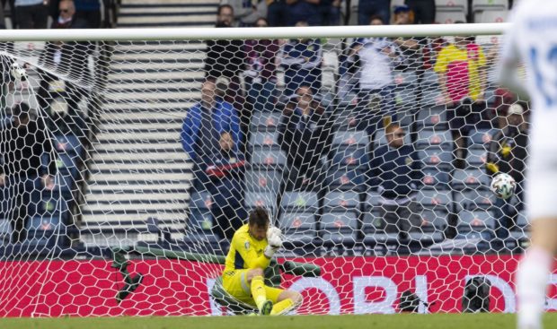 David Marshall is sent careering into the net after Patrick Schick's second goal.