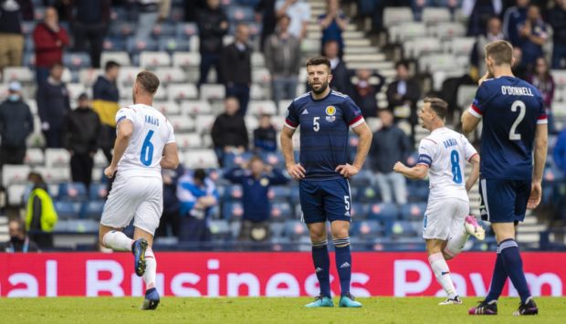 Scotland's Grant Hanley is left dejected after the second goal.