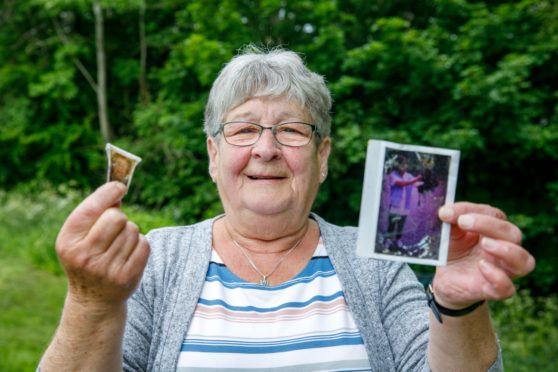 Shelagh with a picture of her mother Agnes (left) and a photograph of her with an owl dating back over 20 years.