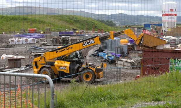 A digger at work at the Cala Homes works entrance in Bridge of Don