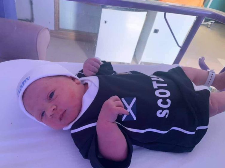 Liam kitted out in national colours just hours after he was born.