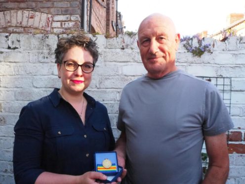 Lyn and her dad, Pete, reunited with the war medal