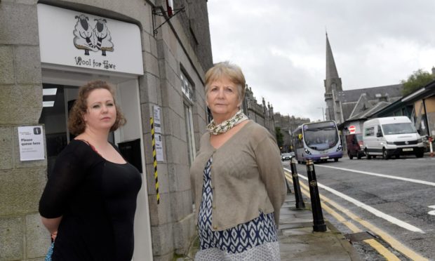 Faye Howard, pictured with fellow Wool For Ewe owner Kathy Fraser, claims customers have turned around and gone home, having got lost in the Spaces For People changes in Rosemount.