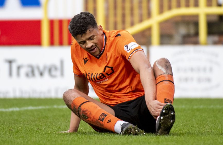 Osman Sow feels his Achilles in his final Dundee United match.