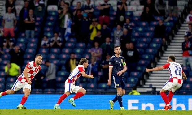 Croatia's Luka Modric (centre) celebrates scoring their side's second goal against Scotland.