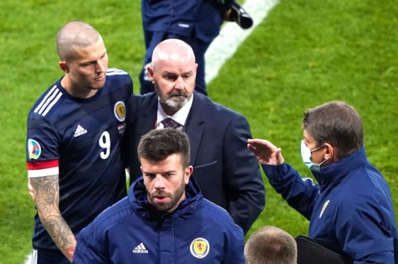 Scotland's Lyndon Dykes and manager Steve Clarke react after the final whistle.