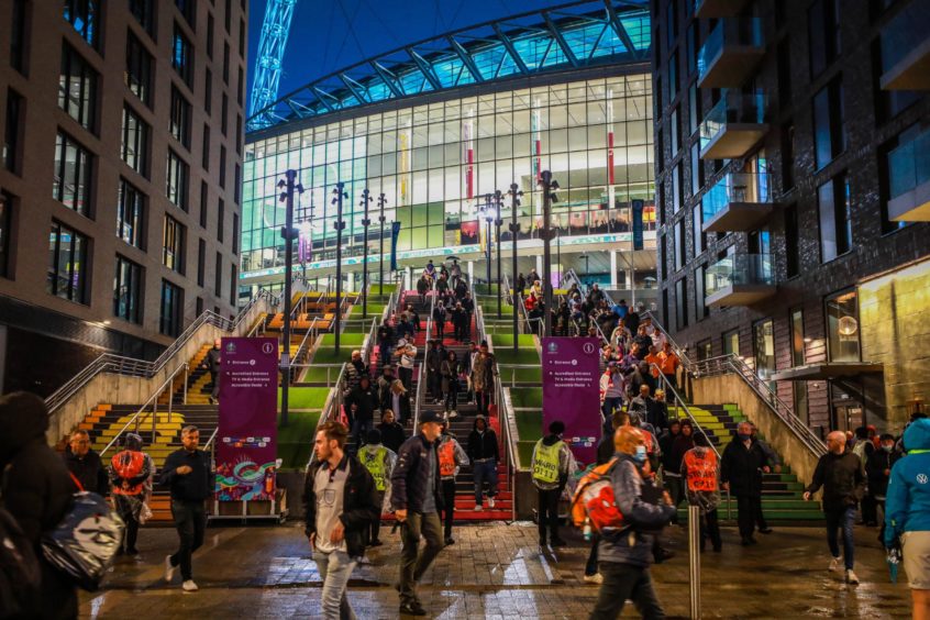 Fans leave the stadium after the 0 - 0 draw.