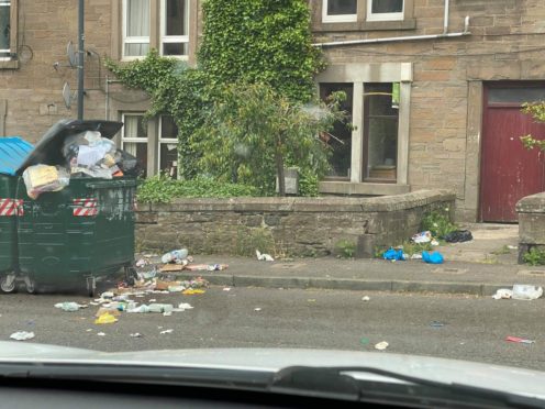 Rubbish is strewn across the street in Taylor's Lane.