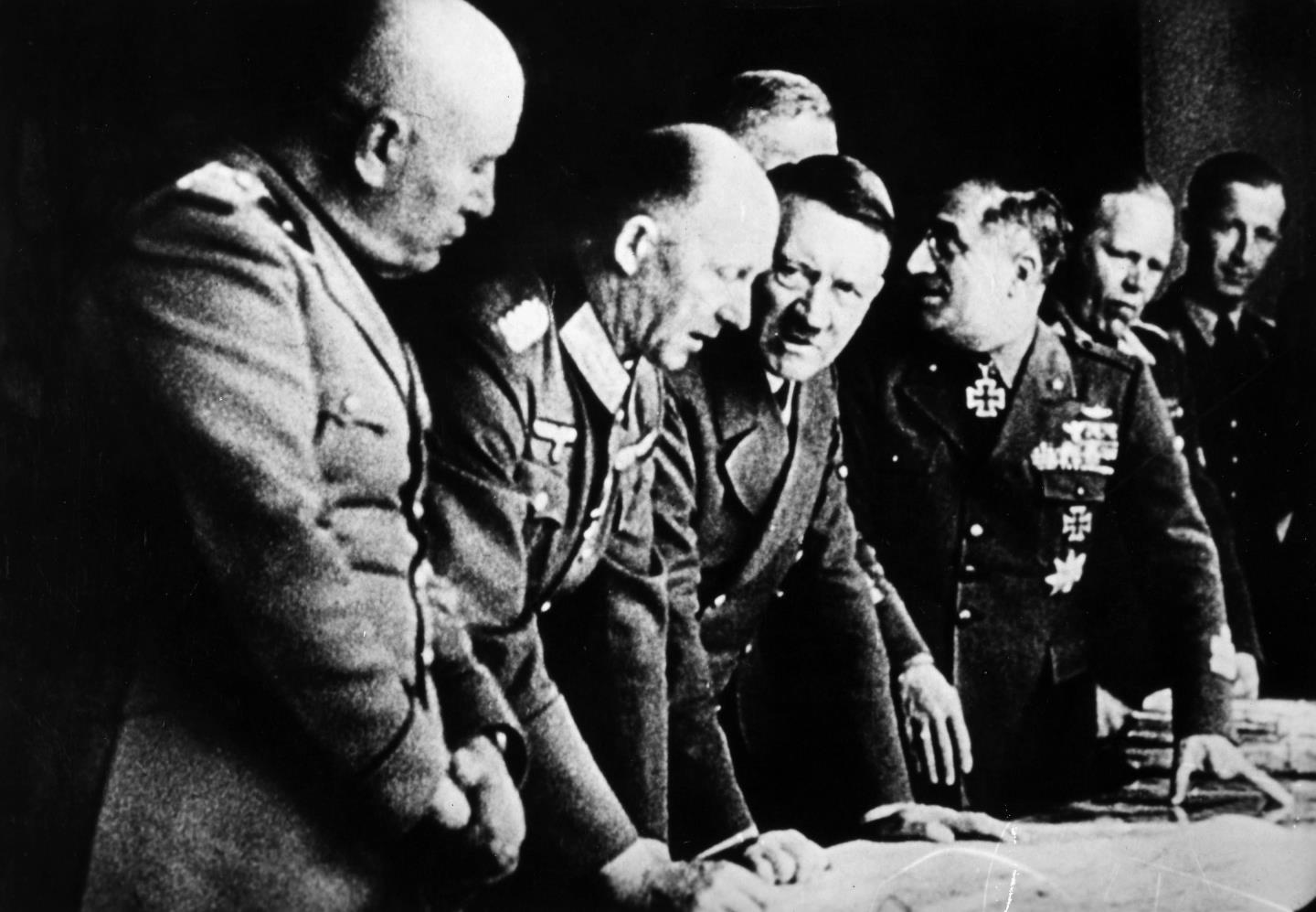 Hitler and the German Chancellor were joined by Mussolini to plan their takeover.