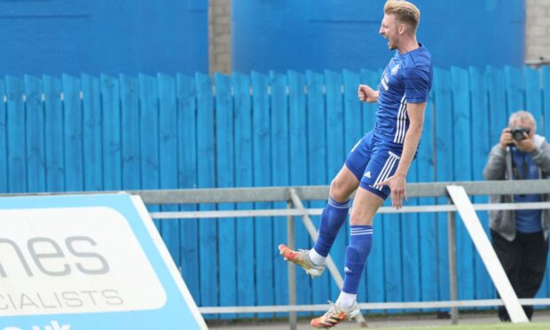 Russell McLean celebrates putting Peterhead 3-1 up against Cove.